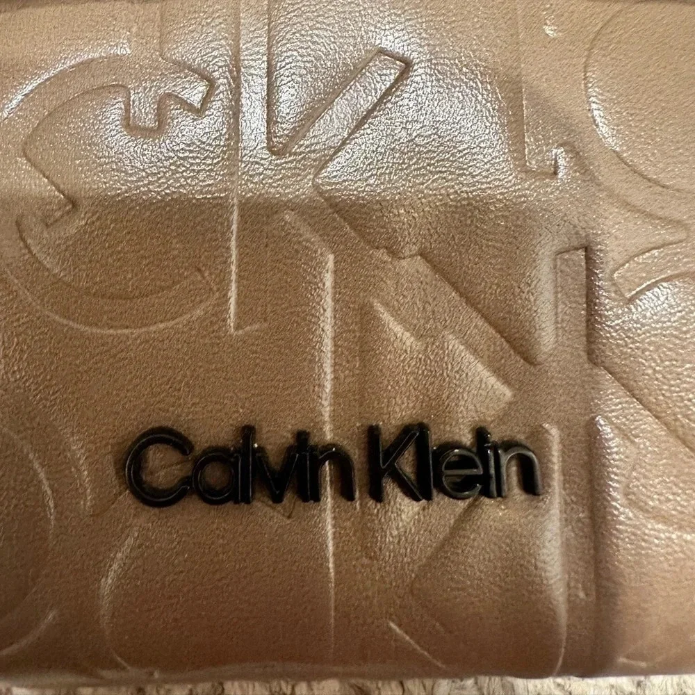 Calvin Klein logo purse. Leather and chain strap. Taupe color, 3 compartments